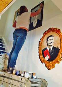 Sarah Hodgkins of Charlotte Designs painting a mural at 44 Harpur Street
