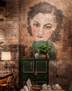 Simple painted mural on a brick wall in a restaurant