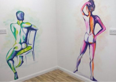 mural features male and female nudes