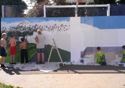 children painting a mural