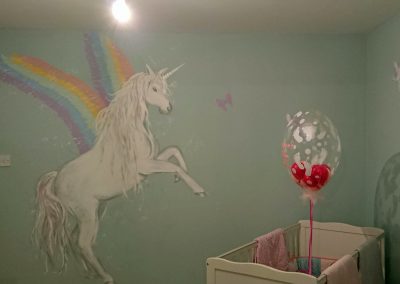nursery with unicorn mural