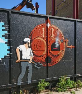 mural man stoking a boiler