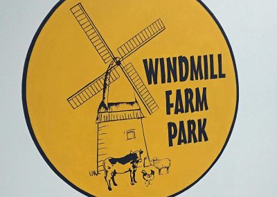 hand painted sign for Windmill Farm