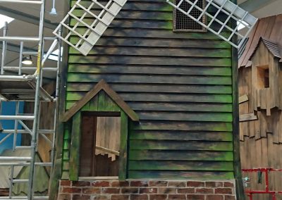 windmill with aging to wood and brick