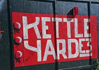 Image of hand painted hoarding sign for building site