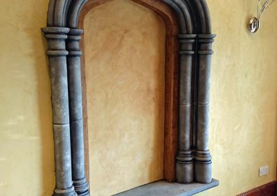 niche painted with travertino and faux oak and stone