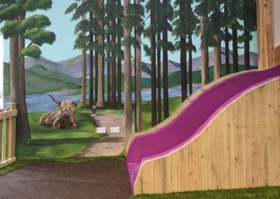 Forest mural with Highland cow