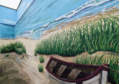 Courtyard painted mural coastal scene with boat