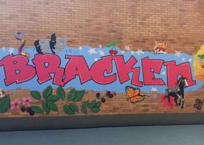 Graffiti style mural with tree, horse, blackberries and a hedgehog