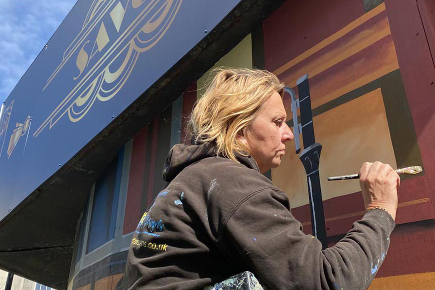 Sarah Hodgkins painting Luton ABC Cinema mural
