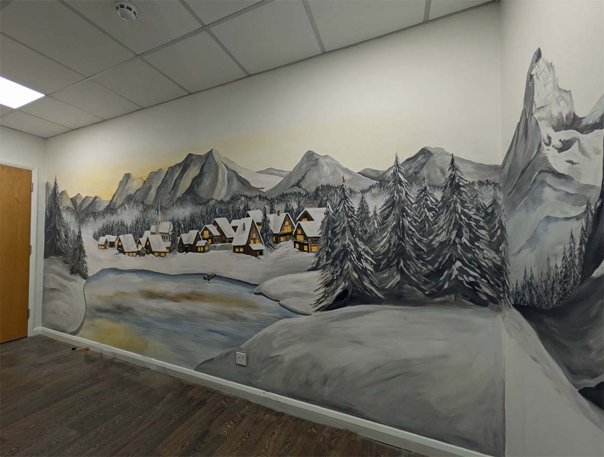 Mountain mural with swiss chalets and lake