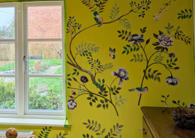 Floral chinoiserie style mural with yellow background and purple flowers